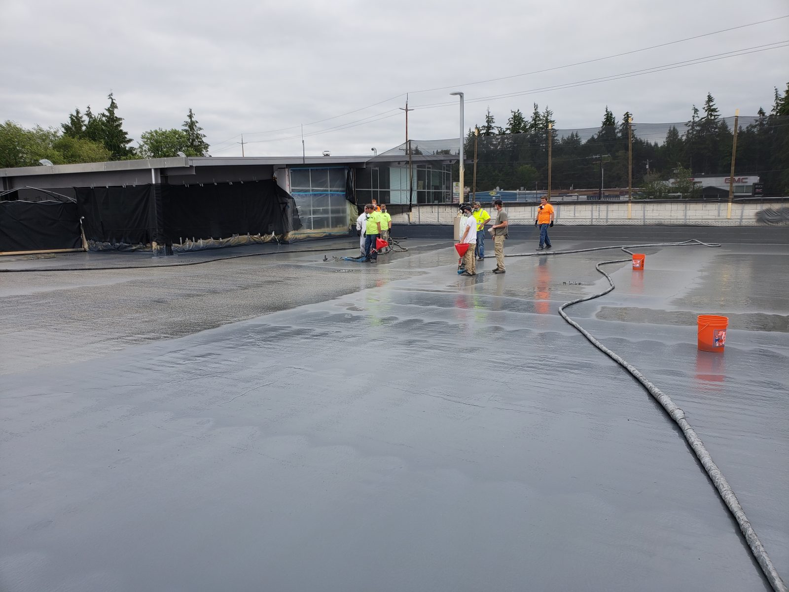 Completed liquid-applied roof membrane on a commercial building