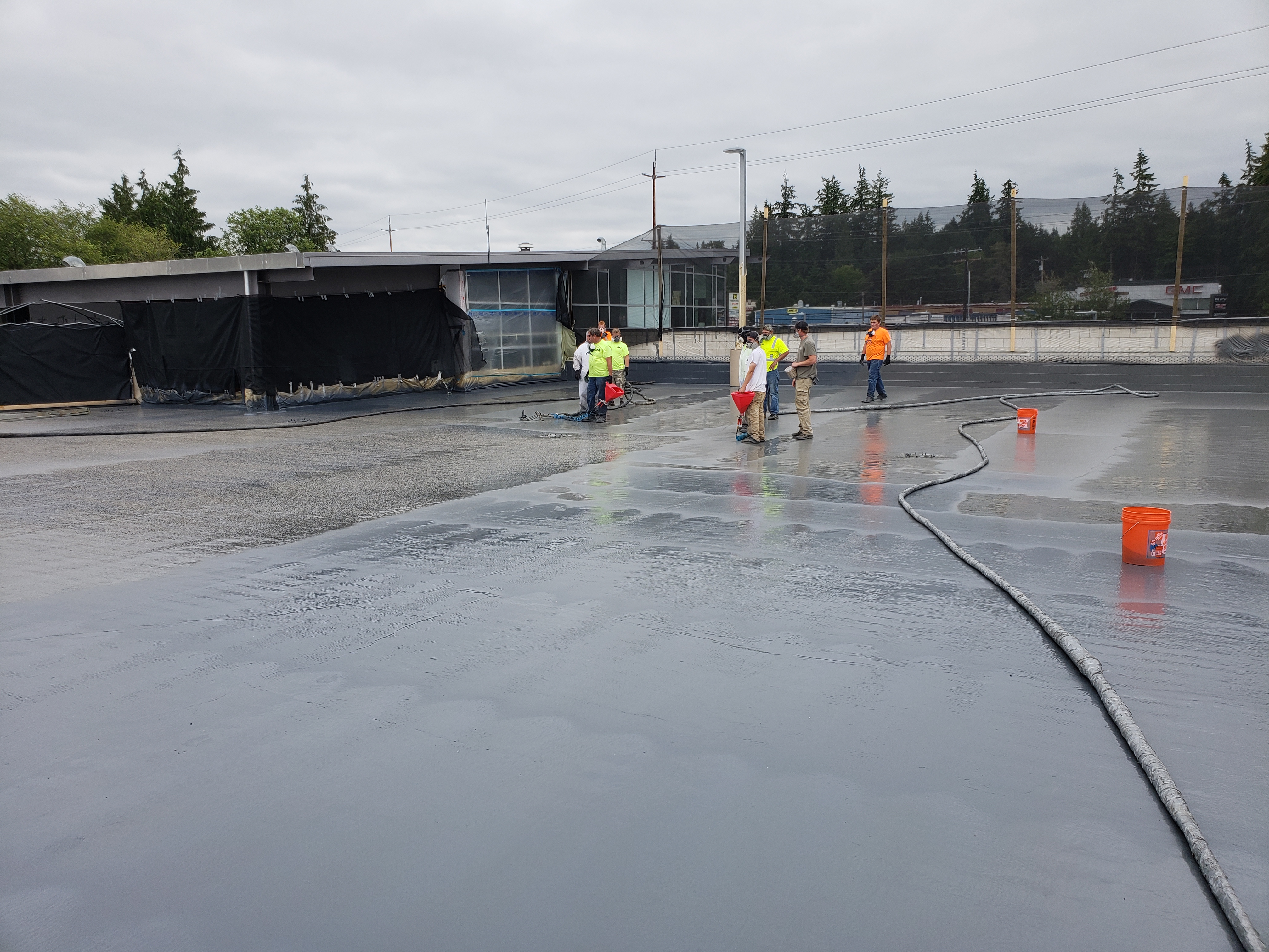 OR-80SLM polyurea membrane sprayed on a commercial roof